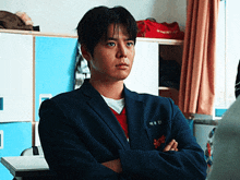 a young man in a blue suit has a name tag on his jacket that says ' a '