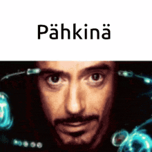 a close up of a man 's face with the word pahkina written above him