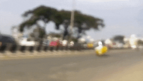 a blurry picture of a person riding a scooter