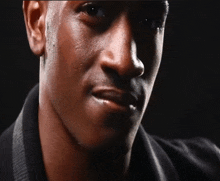 a close up of a man 's face with his mouth open