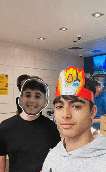 a boy wearing a robot headband stands next to a boy wearing a mask