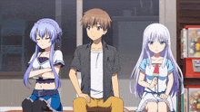a boy and two girls are sitting next to each other in a room