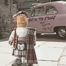 a cartoon character is standing in front of a pink taxi that says " fast on the road "