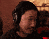 a man wearing a pair of headphones with a triangle on them