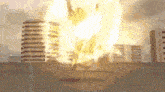 a large explosion in a city with a lot of buildings on fire