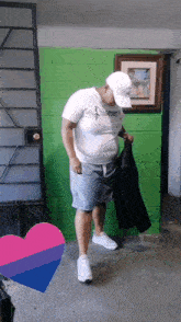 a man wearing a white shirt that says prisoner on it