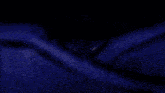 a drawing of a blue and white object with a dark background