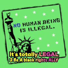 a green sign with the statue of liberty and the words no human being is illegal