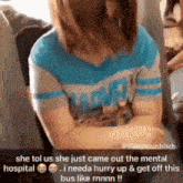 a girl in a marvel shirt is sitting on a couch with her tongue out .