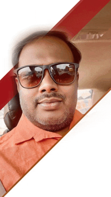 a man wearing sunglasses and an orange shirt is smiling for the camera