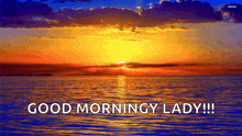 a sunset over a body of water with the words good morningy lady below it