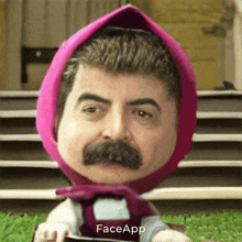 a man with a mustache is wearing a pink head scarf and a face app logo