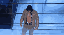 a man in a hooded jacket with the letter ea on it