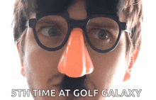 a man wearing glasses and a fake nose has the words 5th time at golf galaxy above his face