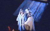 a woman with blue hair and red lips is looking at a man with white hair .
