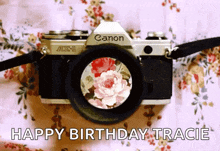 a canon camera with flowers in the lens and the words happy birthday tracie on the bottom