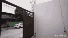 a white car is parked in front of a fence made in animatica