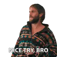 a man with a beard is wearing a sweater that says nice try bro