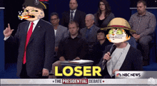 a man in a suit and tie stands in front of a crowd and a sign that says loser on it