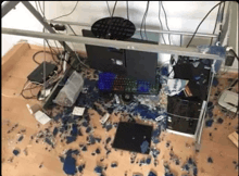 a computer desk with a computer monitor , keyboard , and other electronic devices on it .
