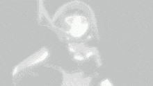 a close up of a person 's face with a shadow of a person behind it