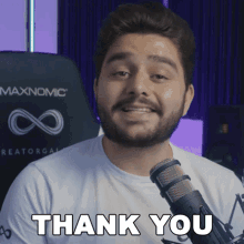 a man with a beard and a white shirt says thank you