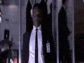 a man in a suit and tie has a badge on his chest that says ' inspector '