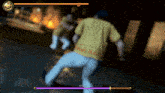a man in a yellow shirt is fighting another man in a game