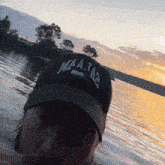 a man wearing a baseball cap that says maa-ta3