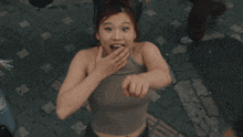 a woman wearing a bandana that says ' a ' on it