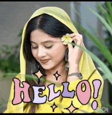 a woman wearing a yellow head scarf is holding a flower in her hand and the word hello is above her