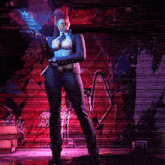 a woman in a suit is standing in front of a wall with graffiti on it and holding a gun