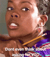 a girl with a pencil in her mouth and the words " dont even think about asking for vto " on the bottom