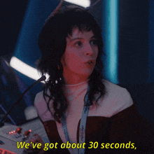 a woman with a lanyard that says we 've got about 30 seconds on it