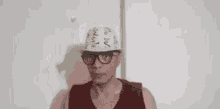 a man wearing glasses and a hat with the word wow written on it
