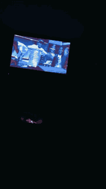 a tv screen shows a man in a military uniform dancing
