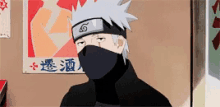 a cartoon character with a mask on his face is standing in front of a wall with a poster on it .