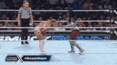 a woman in a wrestling ring with #smackdown written on the bottom