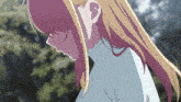 a girl with long blonde hair is wearing a blue sweater