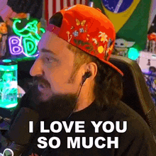 a man with a beard wearing a red hat and ear buds says i love you so much