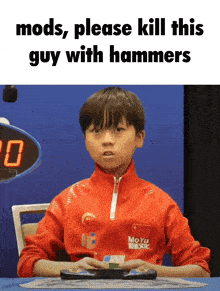 a young boy sitting at a table with the words mods please kill this guy with hammers below him