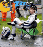 a man sitting in a chair with the word zzz on the bottom