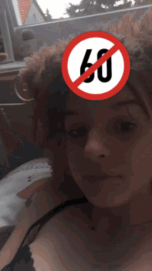 a woman with a red sign that says 60 on it