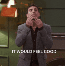 a man in a suit is dancing with the words it would feel good below him