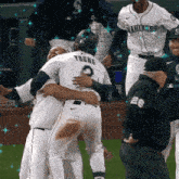 a baseball player named young is hugging another player