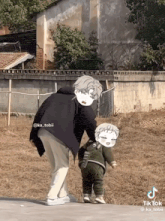 a tiktok video of a man walking a child