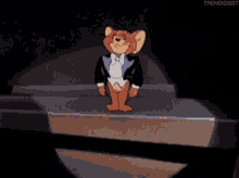 jerry from tom and jerry is standing on a stage