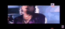 a blurry picture of a man in a purple shirt with modern cinema written on the bottom