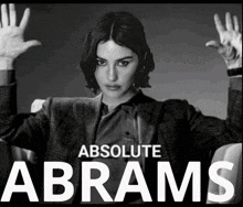 a black and white photo of a woman with the words absolute abrams below her