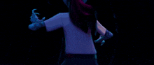 a purple and blue light is coming out of a person 's body